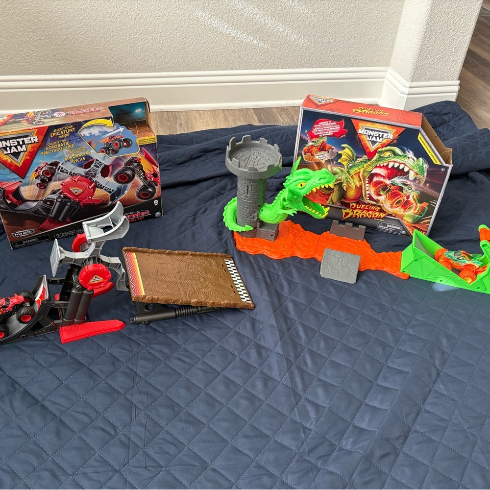 Monster Jam Dragon Playset and red Stunt dial playset